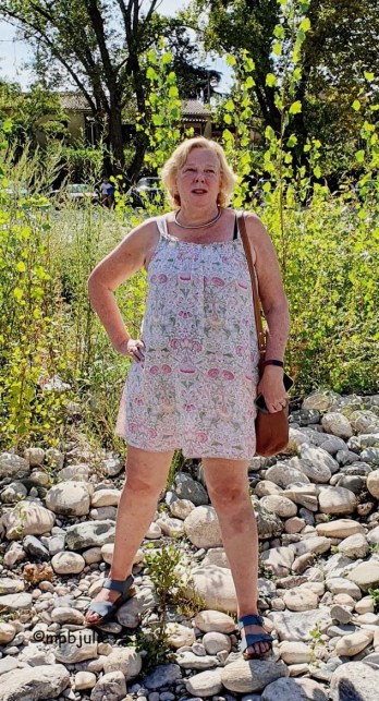 Me standing on a dry river bed wearing a summer dress. The photo was taking las summer.