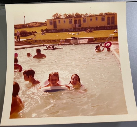 I'm in the swimming pool with my little brother aged about 11. We're at a holiday camp.