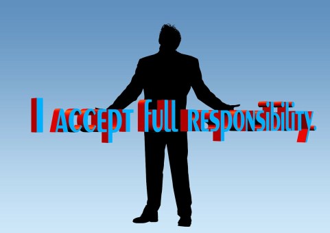 A silhouette of a man with the words I accept full responsibility superimposed over him