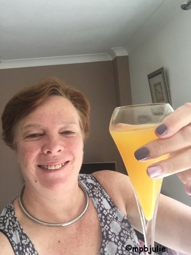 It's my birthday and I'm holding up a glass of bucks fizz