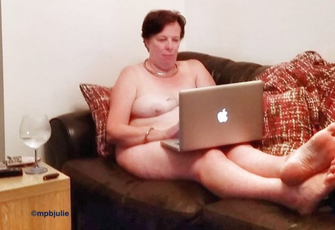 I'm naked on the sofa with my feet up. My laptop is on my lap and you can see most of my body except one boob and arm.