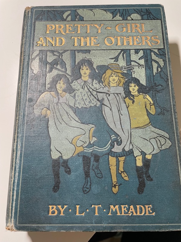 A book titled Pretty girl and the others by LT Meade.