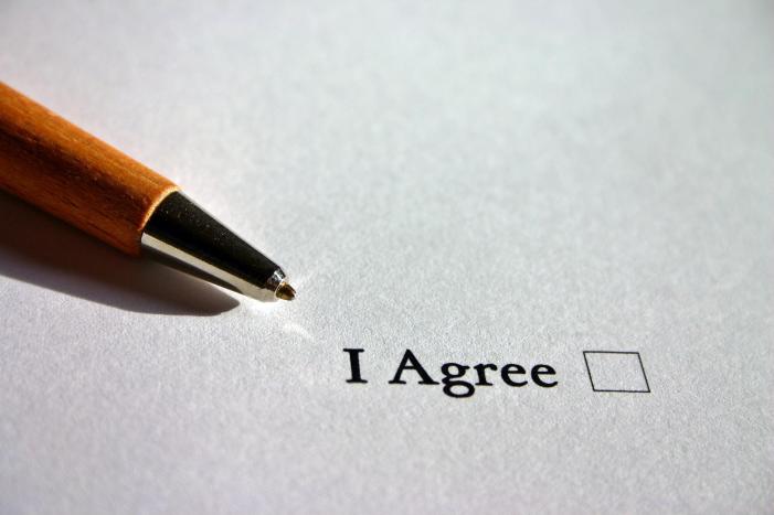Contract - a pen and the words I agree and a box