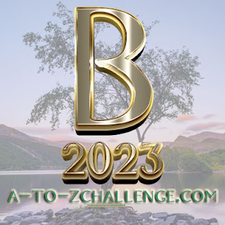 B 2023 A-Z Challenge against the background of a tree, sky and hills. 
