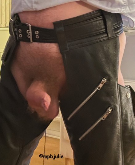 Closer up and an erect cock. Still wearing chaps. 