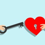 A hand holdig a key and another holding a redd heart
