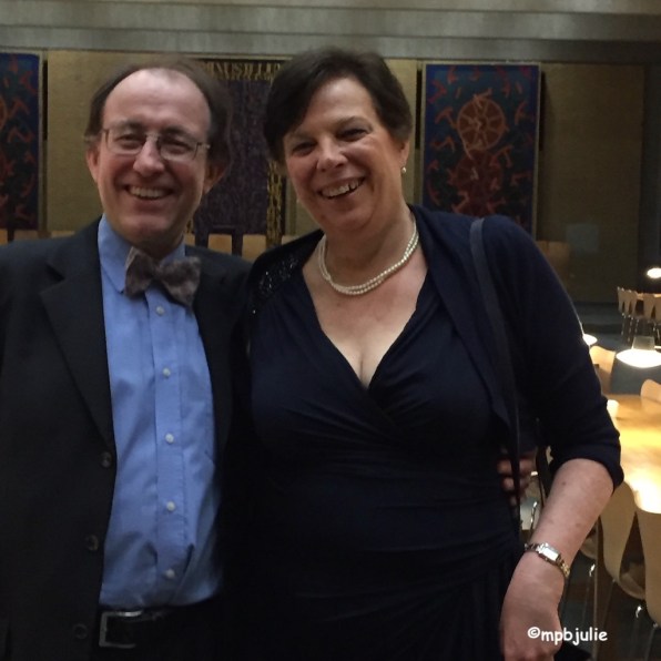 G and me dressed up for a smart dinner. He's wearing a suit, bow tie and blue shirt. I'm wearing a blue dress with my pearls.